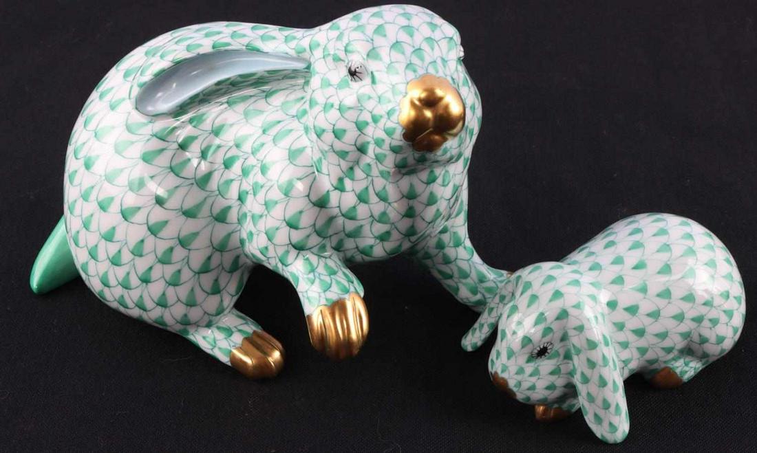 2 HEREND GREEN FISHNET PORCELAIN RABBITS: 2 Herend Porcelain rabbit figurines. Hand painted Hungarian porcelain. Condition: very good with no chips, cracks or repairs. Dimensions: approx. small lop eared rabbit 3.5 x 2 x 3 inches each. Large 