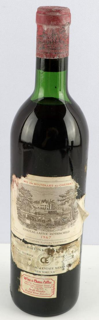 1967 CHATEAU LAFITE ROTHSCHILD BORDEAUX RED WINE: Lot includes a 1967 Chateau Rothschild with upper mid shoulder ullage, sealed cork, and good label with minor tearing and foxing. 750ml bottle. 13% ABV.