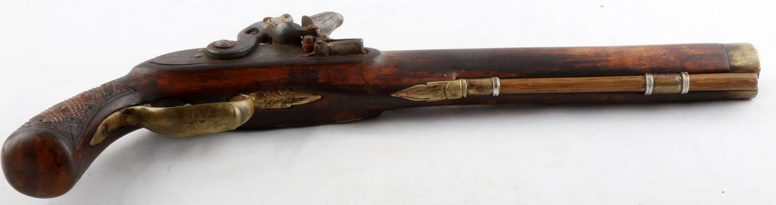 ANTIQUE FLINTLOCK PISTOL FUNCTIONAL: No, 16 inches overall.makers or armory marks, tight lock movement, wood stock brass fittings 11 inch barrel