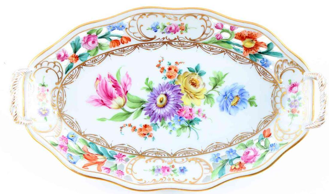 DRESDEN RETICULATED FLORAL PORCELAIN LOT: Lot includes small serving tray. Measures 9.5 inches, by 5.5 inches. Bottom is stamped "DRESDEN 67 76". Also in the lot is a Dresden porcelain and brass letter opener that measures 7.25 inches. In ver