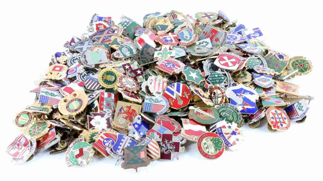 OVER 100 US MILITARY DISTINCTIVE UNIT INSIGNIAS: WWII to modern pins. Some rare examples such as China Burma India and Airborne. Very good condition.