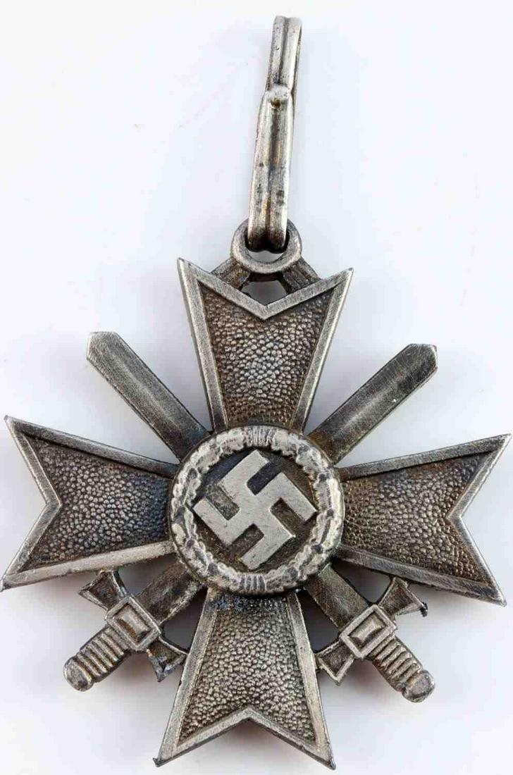 WWII GERMAN REICH KNIGHTS WAR MERIT CROSS W SWORDS: Acid tested for silver. Measures 2 inches. No maker marks. Weighs 50 grams. Unauthenticated, sold as is.