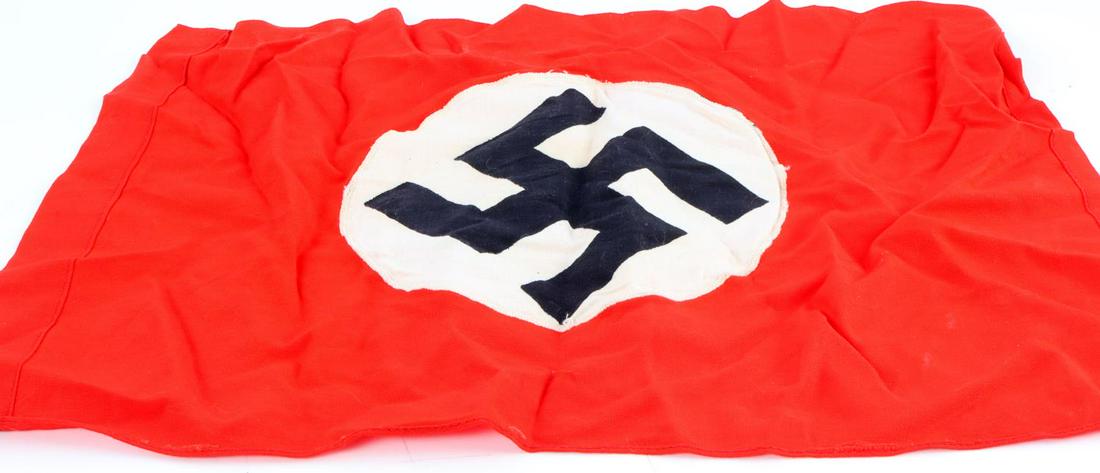 WWII GERMAN REICH SMALL NSDAP BANNER FLAG: WWII German Reich small NSDAP banner flag in good condition. Measures 16 1/4 inches tall by 11 1/2 inches wide. Does not fluoresce. Roundel in center appears to have been machine sewn. Unauthenticated