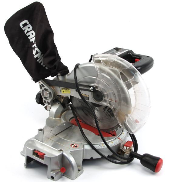 CRAFTSMAN 10 INCH LASER COMPOUND MITER SAW: Laser marker, 40 tooth blade, 15 amps, 4800 RPM, adjustable side supports. Slightly used. Good to very good condition.