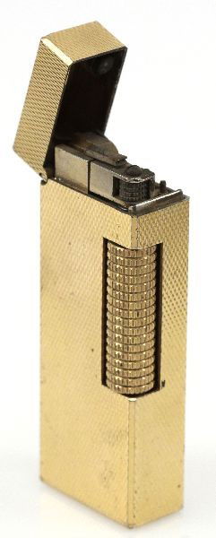 VINTAGE GOLD PLATED DUNHILL CIGARETTE LIGHTER: Gas lighter by Dunhill measuring 2.5x0.75 inches. Plating in good condition. In need of new flint.