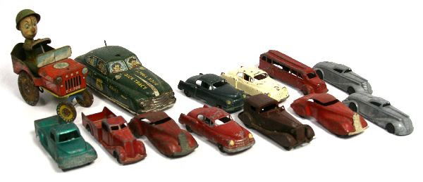 VINTAGE TOYS DICK TRACY CAR GI JOE JOUNCING JEEP: Lot of vintage toys to include: Dick Tracy Police Squad car (missing light on top of car), and GI Joe Jouncing Jeep. Also included are about 11 toy die cast cars (2 with wooden wheels, 2 are Metal Mas