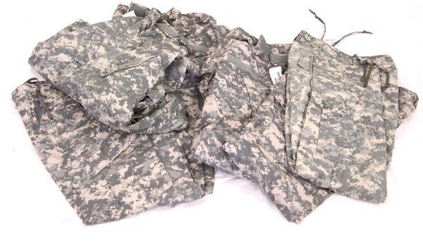THREE SETS OF MILITARY ISSUE ACU SHIRTS TROUSERS: Three sets of US issue Army Combat Uniform shirts and trousers, in digital camouflage pattern. All are size medium long. Two sets are new with tags, one set appearing lightly used. Overall very good c