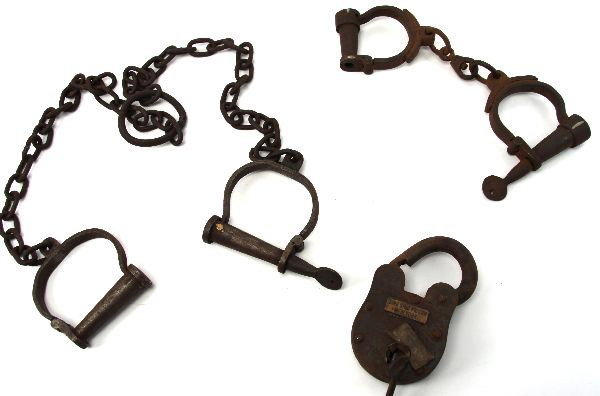 PRISONER LEG HAND IRONS & SING SING PRISON LOCK: A collection of deemed spurious leg and hand irons, also a lock with a Sing Sing Prison glued on plate.