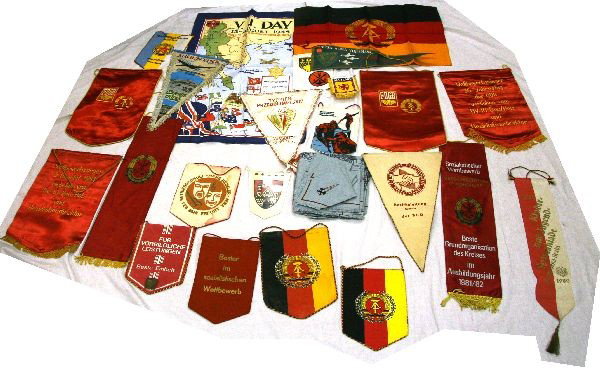 COLLECTION OF EAST GERMAN & OTHER BANNERS: A collection of over 20 mostly East German Socialist pennants and banners, also some circa 1060's Venezuela, GDR flag and a few other non East German.