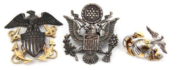 LOT OF THREE WWII ERA US MILITARY HAT INSIGNIA: Lot of three WWII era US Military hat insignia. USMC sterling silver hat insignia. US Navy Sterling and 1/20 12K hat insignia by Bancroft, and a US Army hat insignia, maker marked N.S. Meyer.