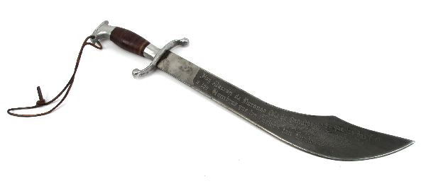 DECORATIVE ENGRAVED MACHETE: Decorative machete, with 17 inch blade. Wilderness scene engraved on one side, with phrase in Spanish engraved on other. Overall good condition.