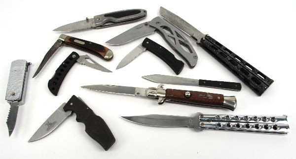 LOT OF 11 VARIOUS POCKET KNIVES: Lot of eleven various pocket knives, including folding knives, an small automatic stiletto, two balisongs and a throwing knife. Some brand names like Schrade & Gerber, as well as some lower end manufa