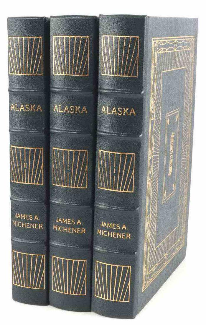 2 VOLUME SET OF EASTON PRESS JAMES MICHENER ALASKA: Collectors Edition in like new condition. Two-volume set is leather bound with 24kt gilt edging.