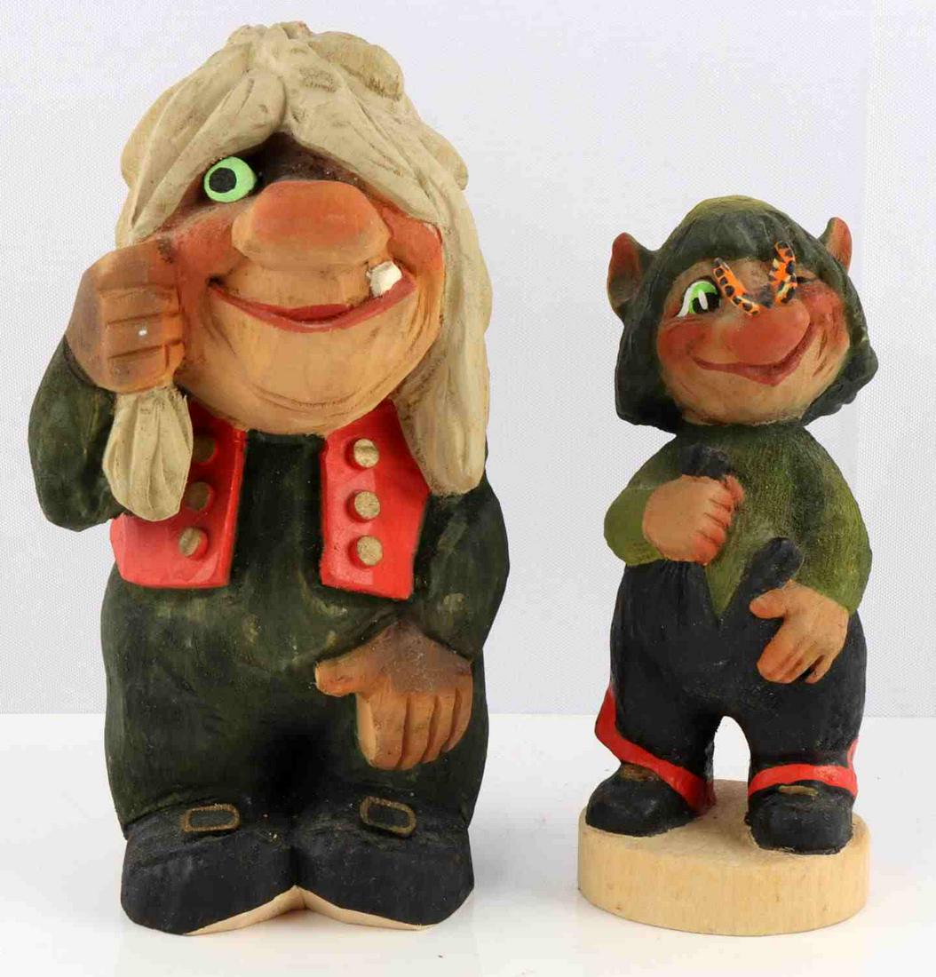 VINTAGE HENNING NORWAY CARVED WOOD TROLLS: Vintage Henning hand carved wooden troll figurines. Both are in very good condition. Larger measures 8 inches tall. Smaller measure 6.5 inches tall. Both are marked with branding on bases.