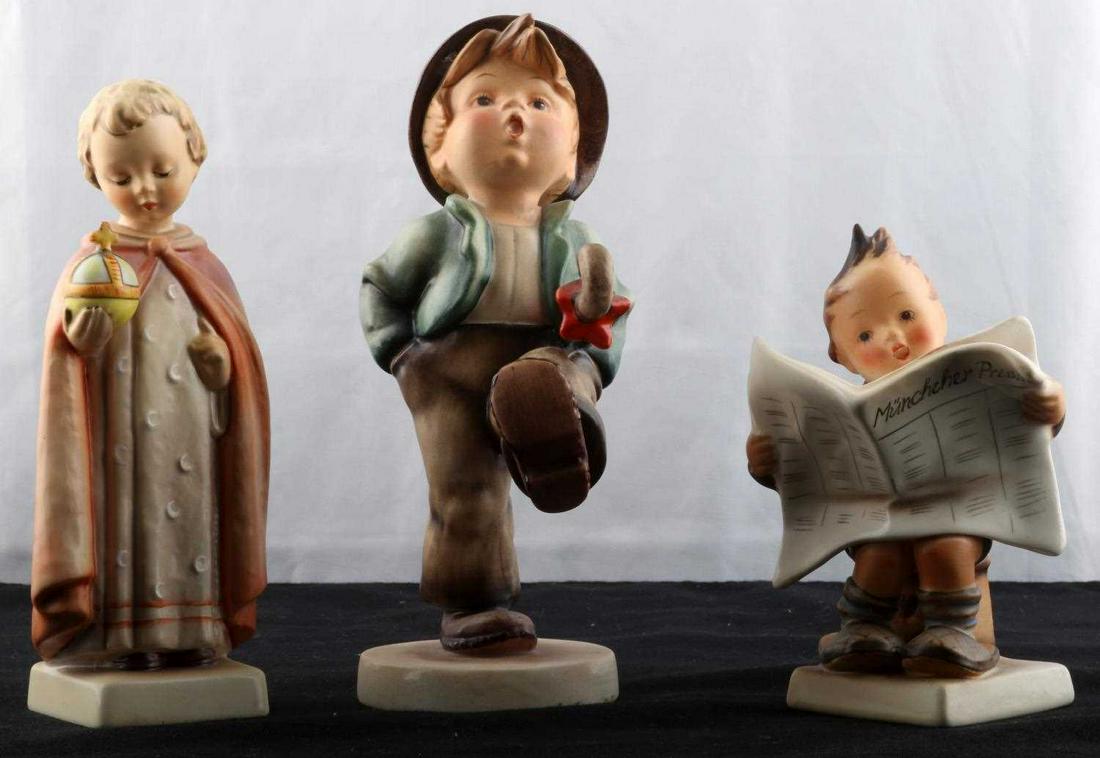 HUMMEL FIGURINE LOT 109 70 184: Christ Child 7.25 inch 70, Newspaper boy 184 6 inches, Umbrella 109 7 3/4. All very good free of detractions.