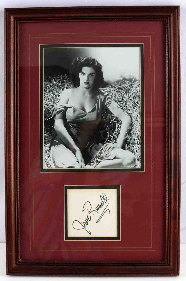 JANE RUSSELL THE OUTLAW PHOTO W AUTOGRAPH CARD: Approx 20x13 inch professionally framed and double matted display of Jane Russell Photo with autographed index card.