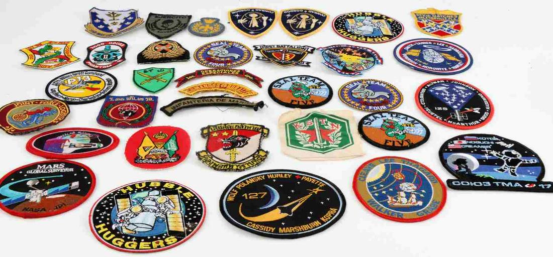 LOT OF 34 US & FOREIGN MILITARY AND NASA PATCHES: Lot of 34 foreign and domestic military patches. 11 foreign patches from various countries. 12 U.S. military patches, includes five Navy Seal patches, one marines, three Airforce and assorted others.