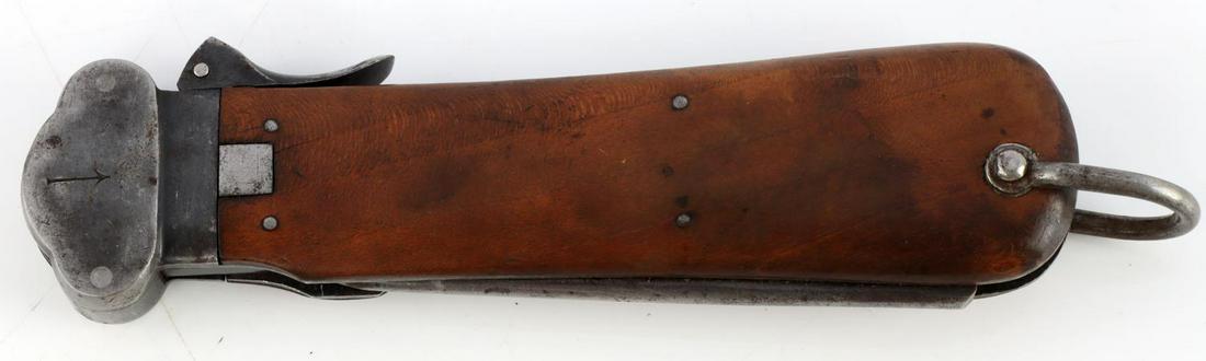 WWII GERMAN LUFTWAFFE PARATROOPER GRAVITY KNIFE: WWII German Third Reich Luftwaffe Paratrooper Gravity Knife, measures approx. 10 inches in total length. Steel blade with wood grip. Numbered 233. Very good condition.