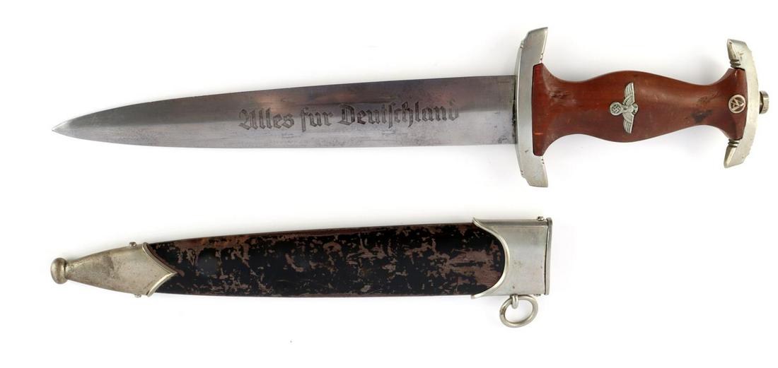 WWII GERMAN SA DAGGER WITH SCABABRD: WWII German SA dagger with scabbard. Nickel pommel marked 'M' and crossguard marked 'S'. Brown wooden handle with eagle and SA inserts. E&F Horster Solingen made blade indicated by the RZM M7/36 maker