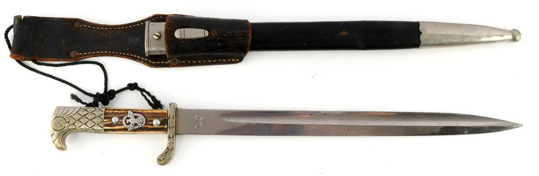 WWII GERMAN POLICE DAGGER W SCABBARD ALCOSO: WWII German Police dagger with scabbard. Nickel plated Eagle head pommel and oak leaf crossguard. Crossguard marked "S.M.V. 2011." Stag horn grips in good condition. Police insignia insert. Alcoso mad
