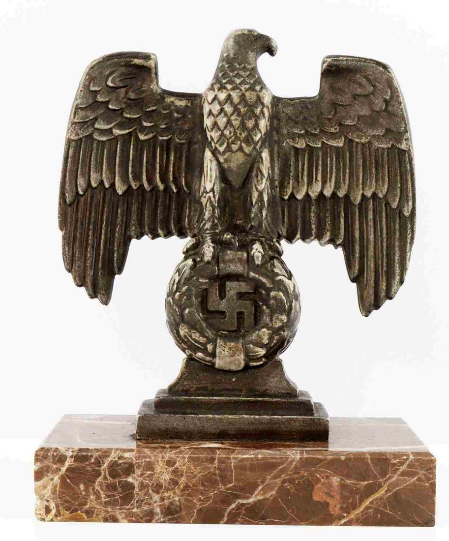 WWII GERMAN THIRD REICH DESK EAGLE ORNAMENT: White metal construction on granite plinth. Measures 6 1/4 inches. Very good condition. Signed on the reverse but difficult to discern. Unauthenticated, sold as is.