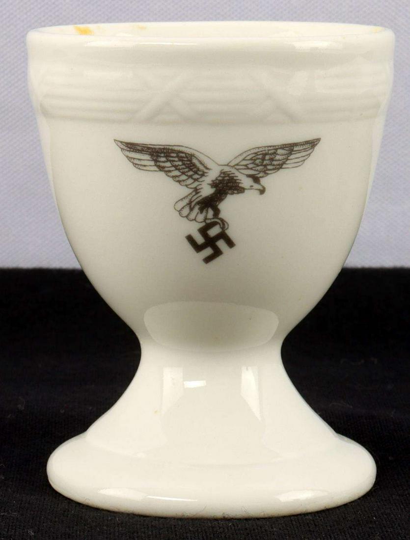 WWII GERMAN THIRD REICH LUFTWAFFE EGG HOLDER: Porcelain egg holder with Luftwaffe eagle. Stands 2 1/2 inches. Marked DVG Bauscher. Very good condition.