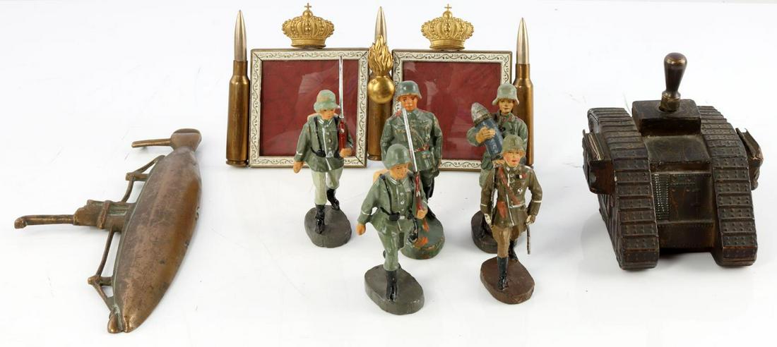 WWI MILITARY TANK LIGHTER GERMAN TOY SOLDERS UBOAT: 1) Ronson WWI tank table lighter with original striking wand, marked "LVA C. 1919." 3 inches tall, 3 1/4 inches wide, 4 inches long. In good condition, paint is worn and small pieces on side have been