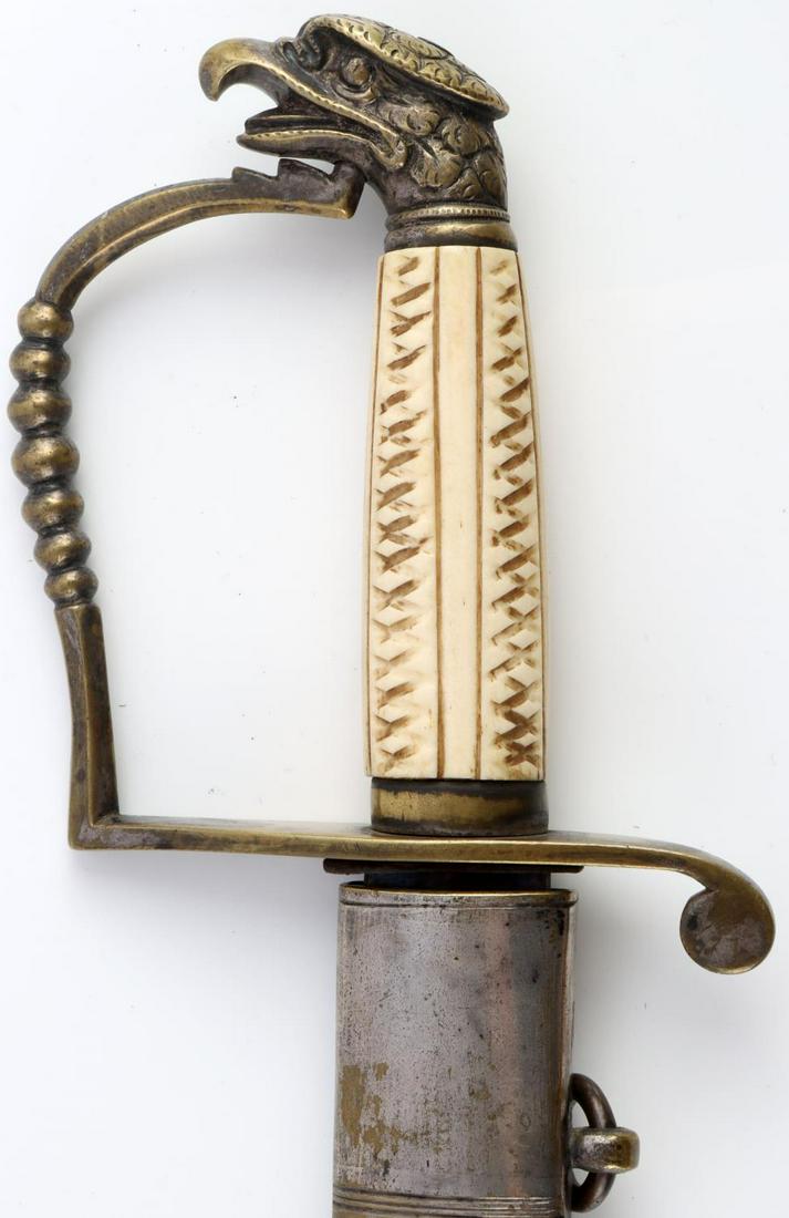 1812 EAGLE HEAD POMMEL CAVALRY OFFICER SWORD: Nice blade with original niter blue with gold, knuckle bow guard integrated into eagle pommel, bone grip and very good original leather scabbard, some silver gilt loss, light play in guard, tight and 