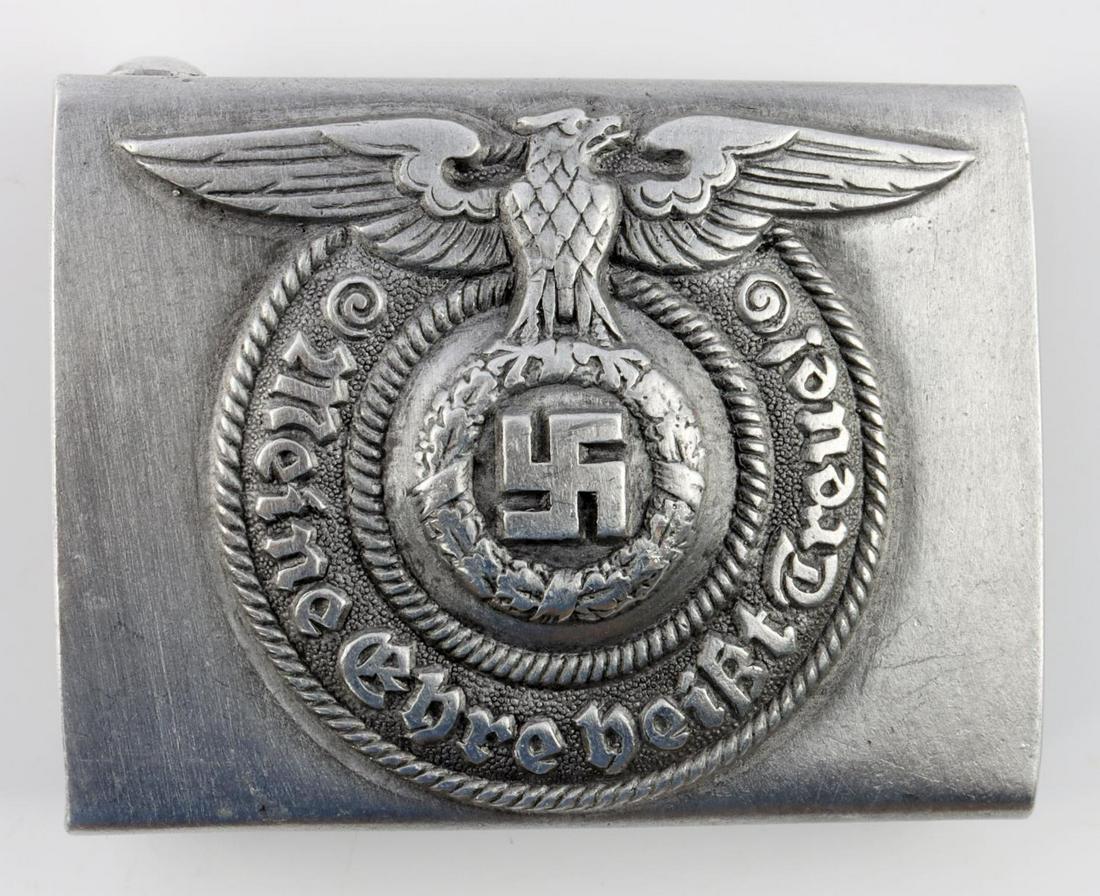 WWII GERMAN THIRD REICH SS EM BELT BUCKLE: Typical belt buckle with Parteiadler and SS motto. Reverse marked RZM 822/37 SS. Aluminum construction. Very good condition. Measures 2 3/8 inches.
