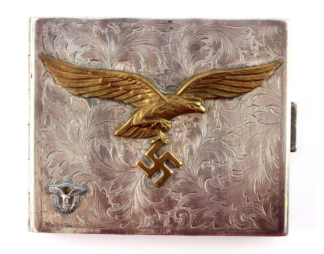 WWII GERMAN THIRD REICH LUFTWAFFE ALPACCA CIG CASE: Luftwaffe cigarette case in alpacca silver. Luftwaffe eagle in center with small pilot/observer badge bottom left corner. Kraftalpacca marked with feinsilberauflage. Measures 3 1/2 inches.