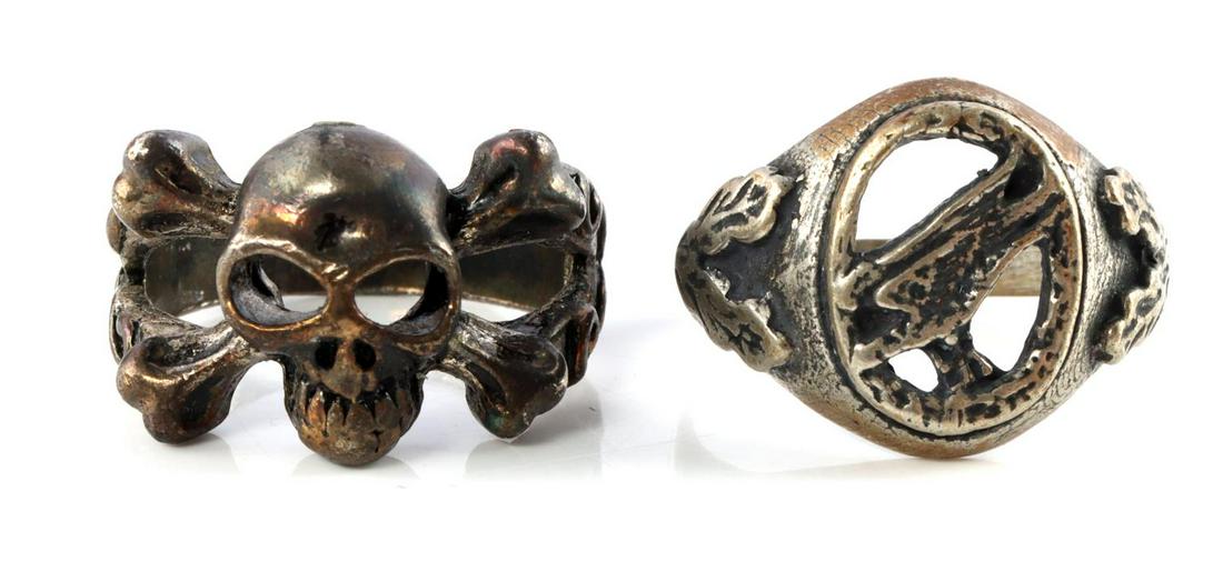 WWII GERMAN REICH LUFTWAFFE BADGE & SKULL RING: Luftwaffe paratrooper badge ring in brass with 00 marked on shank. Also a totenkopf and laurel leaf ring. Very good condition. Sizes 10 & 11.