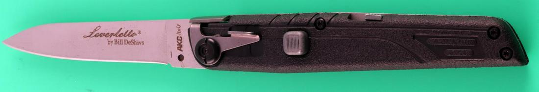 BILL DESHIVS SWITCHBLADE LEVERLETTO AUTO KNIFE: AKC Italian Bill DeShivs Leverletto horizontal single action automatic tactical knife. Unused, measures 7 3/4 inches open and 4 1/2 closed, blade material is 440C hardness: 58-60HRC, and handle is mad