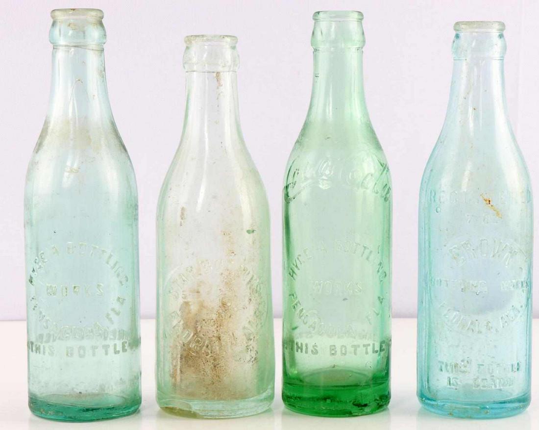 FOUR VINTAGE STRAIGHT SIDE BOTTLES COKE HYGEIA: Lot of four 1900s vintage straight sided glass bottles. (1) Coca-Cola Hygenia Bottling Works of Pensacola FLA. Some chips can be seen on base but overall good condition. (2) Star Bot. Wks. Florida Ala