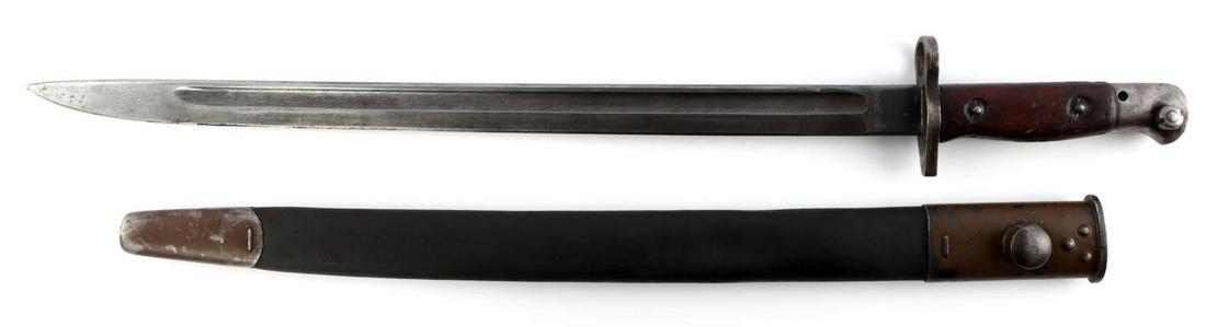 WWI BRITISH LEE ENFIELD BAYONET & SCABBARD 1907: WWI British Lee Enfield bayonet & scabbard marked "1907" on blade ricasso alongside maker's and proof markings. Blade measures 17 inches long. Bayonet locking mechanism functions without issue. Scabba