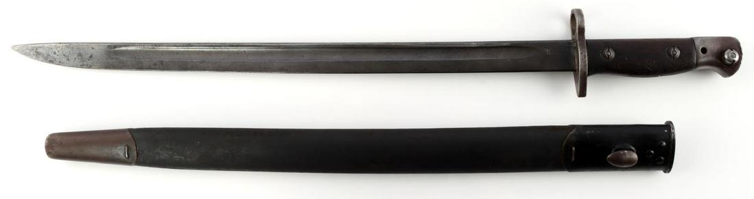 WWI BRITISH LEE ENFIELD SWORD BAYONET & SCABBARD: WWI British Lee Enfield sword bayonet & scabbard in good condition. Proof and maker's marks all throughout ricasso. Marked "907" on ricasso, likely used to say "1907". Bayonet mechanism functions well