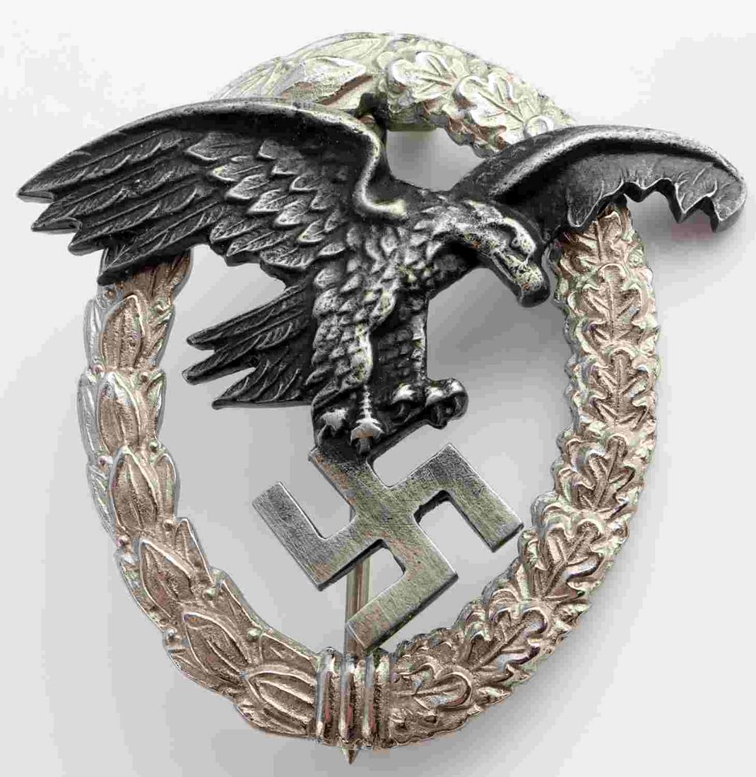 WWII GERMAN T REICH LUFTWAFFE PILOT OBSERVER BADGE: White metal construction. Eagle riveted to wreath. Vertical pin with C catch. No maker marks. Measures 2 inches. Very good condition. Age indeterminate.