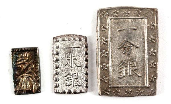 JAPAN SHOGUNATE SILVER 1 BU & SHU & GOLD SHU COINS: A Japanese square 1 BU silver Shoganate cast coinage a weight of 8.7 grams VF condition, C#16b Tempo era, a silver Shu C#21.8 grams Kaei era VF. lastly a gold and silver 2 Shu Nishu Gin Tempo era 1.6