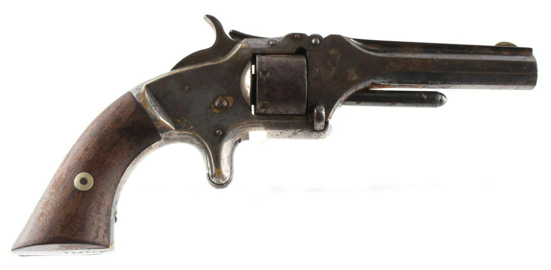 SMITH & WESSON 1ST MODEL 2ND ISSUR TIP UP REVOLVER: Cylinder is dated 1865, shoots 7 rounds 22 short, functions well with smooth tight action, bore is clear light surface rust in a few areas, about 50 % original bluing. Measures 7 inches overall. No in