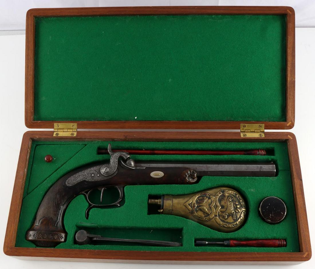 CASED FRENCH PERCUSSION PISTOL WITH TOOLS: French percussion pistol with powder measure, ram rod, 13.6mm round balls, caps, round ball mold, and a take down tool. Gun has a nicely carved grip. Receiver is engraved with PERIN LE PAGE A PARIS. B