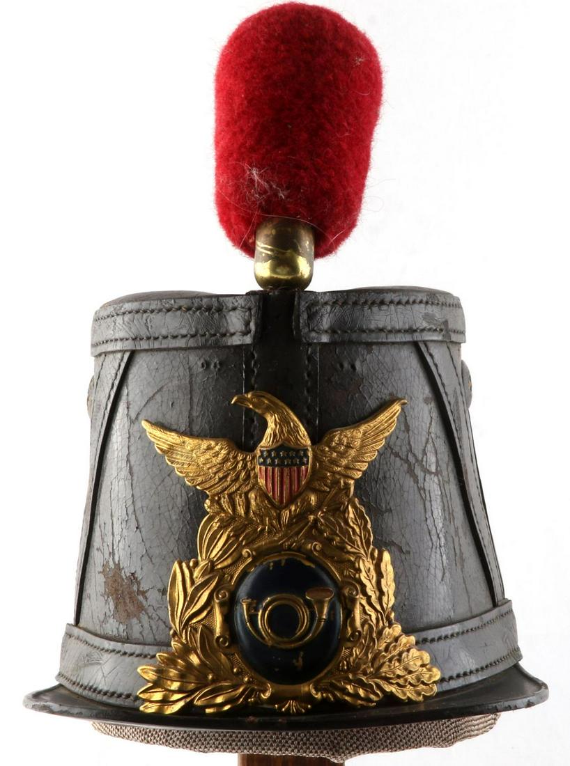 CIVIL WAR CHASSEUR PATTERN LEATHER SHAKO HELMET: Very good original condition, does have age wear and patination block E under visor and then again rear inside in hand, unusual, with red artillery Pom