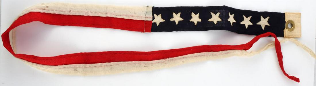WWI WWII US NAVY COMMISSIONING PENNANT FLAG: White and blue at the hoist, bearing seven white stars, and the rest of the pennant consists of single longitudinal stripes of red and white. Measures 48 inches. Very good condition. Marked Comm. Penn