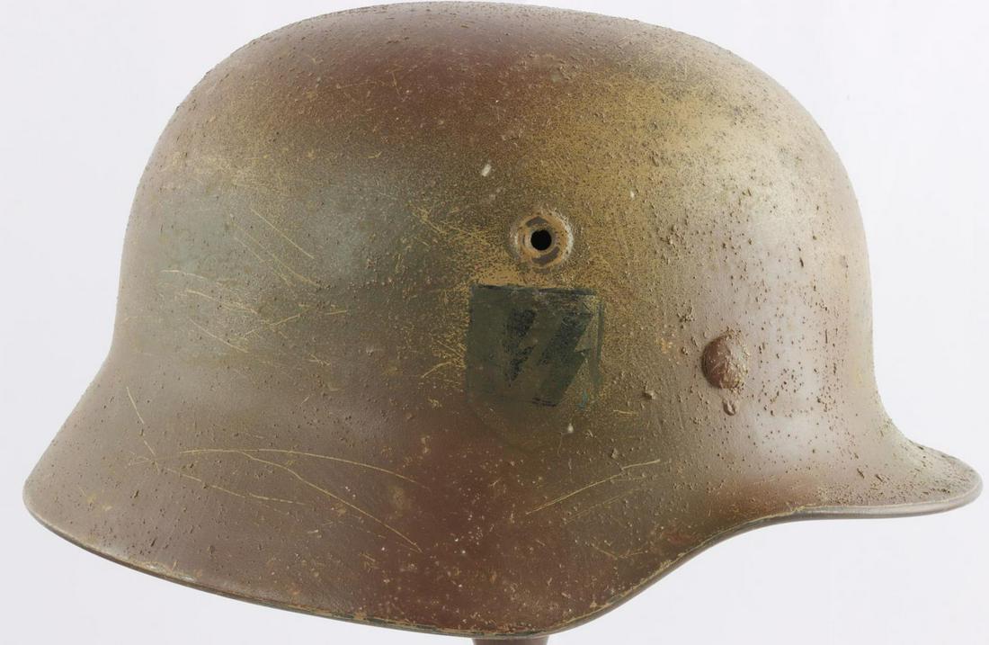 WWII GERMAN THIRD REICH SS NORMANDY CAMO HELMET: M40 Helmet rear inside stampedQ64 over DN519, good 8 finger liner, good original paint interior, very good exterior camo, decal is age indeterminate, no chinstrap, nice example.