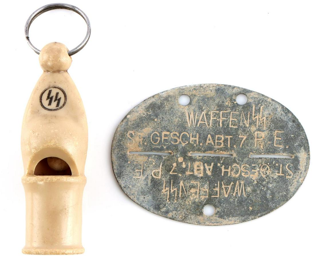 WWII GERMAN WAFFEN SS BAKELITE WHISTLE & DOG TAG: Lot of 2 features a bakelite whistle for an SS officer and a dog tag stamped Waffen SS St. Gesch Abt. 7 P.E. Both measure 2 3//4 inches. Very good condition.