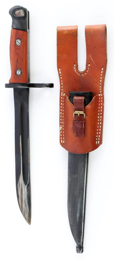 WWII JAPANESE PARATROOPER 100 BAYONET W SCABBARD: WWII Japanese Paratrooper type 100 bayonet and scabbard by the Nagoya/Toyata Automatic Loom Works arsenal. Measures 13 3/4 inches long overall. The blued steel blade measures 8 1/16 inches long by 1 i