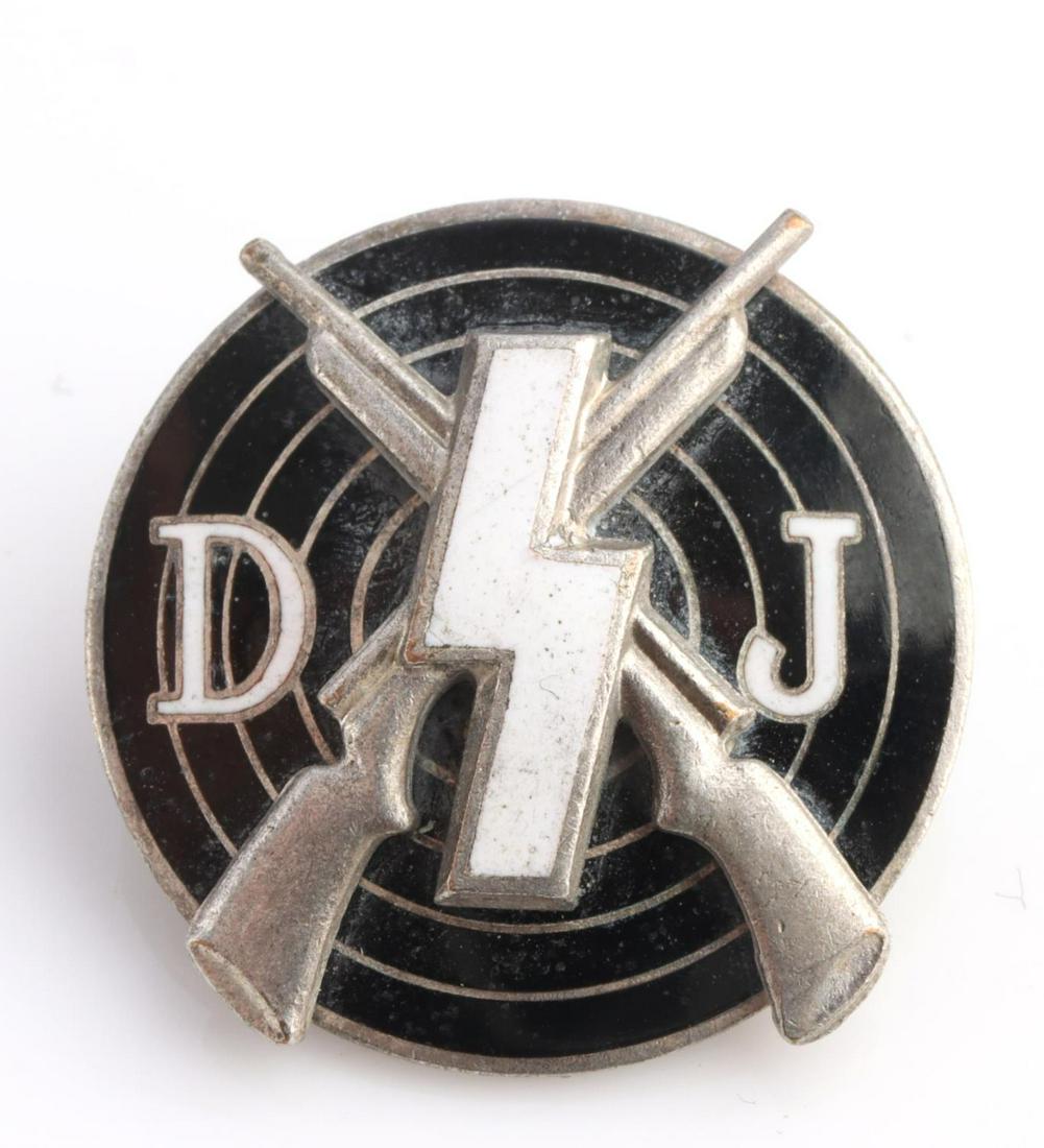 WWII GERMAN DJ SHOOTING MARKSMAN BADGE: German WWII Deutsches Jungend DJ Marksman Shooting Badge. Measures 13/16 inch diameter. The front shows a DJ runic with a pair of cross rifles in the back ground. It is mounted on a bulls eye target w