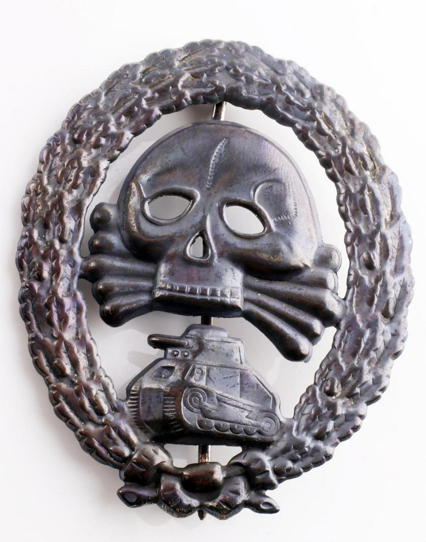 WWII GERMAN REICH CONDOR LEGION TANK ASSAULT BADGE: Good overall condition. Has a thin vertical pin back with a ‘c’ catch. One piece die struck stamped nickel construction. Unauthenticated, sold as is.