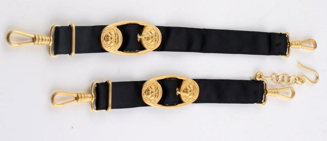 WWII GERMAN KRIEGSMARINE OFFICERS DAGGER HANGERS: German WWII Naval Kriegsmarine Officers Dagger Hangers. The first upper one measures 1 5/16 X 10 3/4 inches. The lower one measures 1 5/16 X 13 7/8 inches. The buckles on both hangers shows two lion h