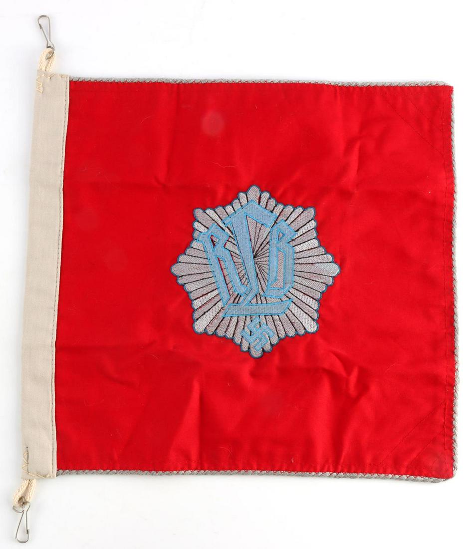 WWII GERMAN RLB LUFTSCHUTZ OFFICERS CAR PENNANT: German WWII RLB Luftschutz Officers Staff Car Pennant. Measures 12 1/4 X 11 1/2 inches. The front and the back shows the letters RLB in the center of a star burst. There is a swastika at the base. Has