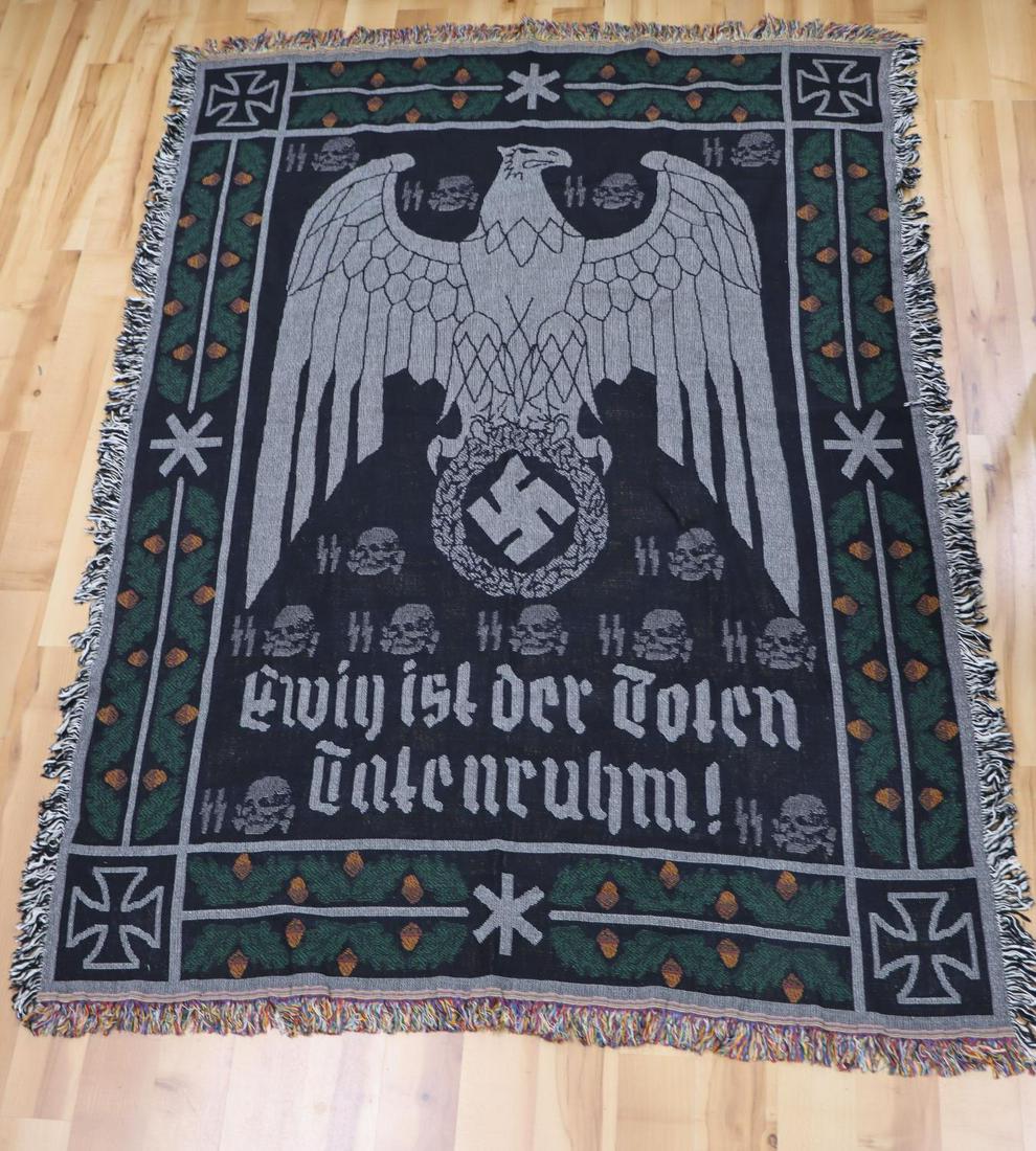 WWII GERMAN THIRD REICH WAFFEN SS RUNE TAPESTRY: German WWII Waffen SS Rune & Skull Wall Tapestry. Measures 50” wide by 68” inches tall.The front reads Eivin ist der Toten Enteuruhni! It shows a German eagle clutching a swastika inhis talons in 