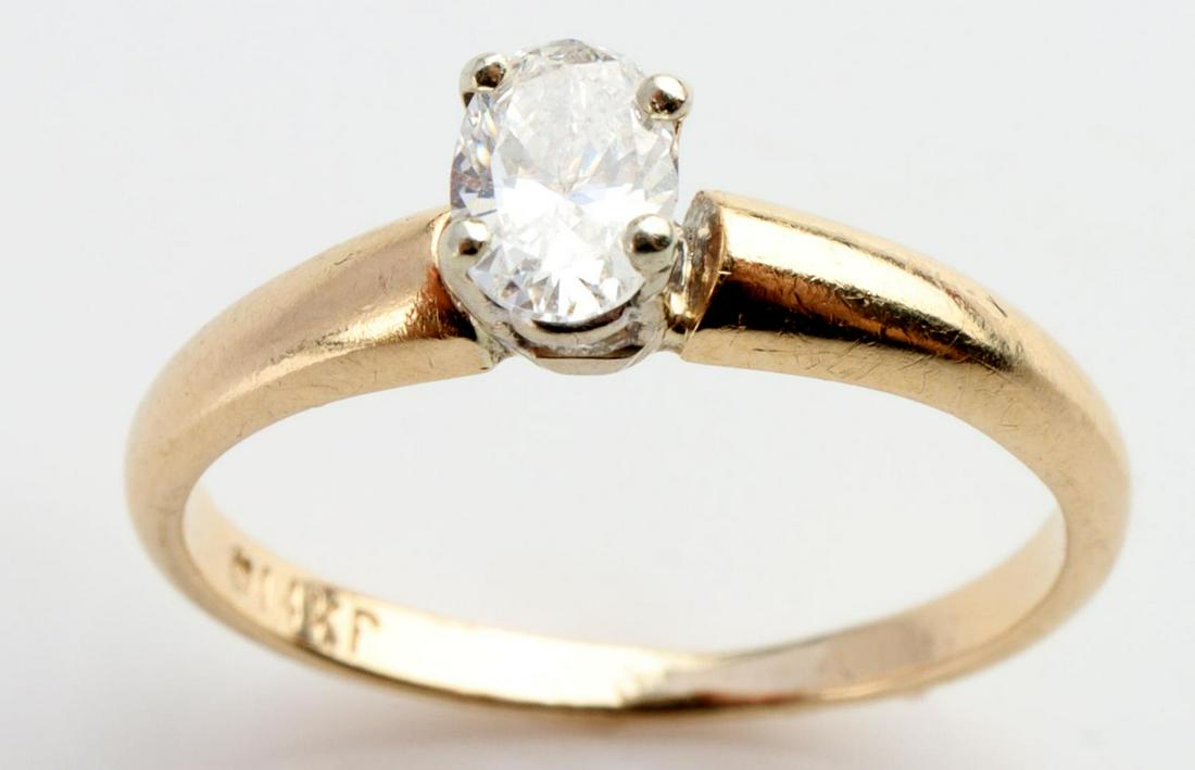 14KP GOLD AND DIAMOND ENGAGEMENT RING SZ 3: 14 KP gold engagement ring with Oval faceted solitaire diamond approx. 4.7 x 3.3mm. TCW 1/4, clarity VS-SI, color G-H, Total weight 1.3 grams, Size 3